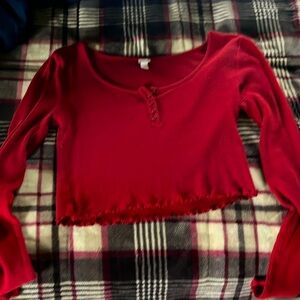 red buttoned long sleeve cropped shirt